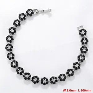 Detail view of flower link bracelet with black and white zircon stones and 8mm width text