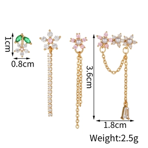 Macro detail of gold flower earrings set with pearls and zircon stones showing 3.6cm size