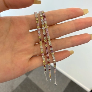 Three rows of S925 silver tennis bracelets with colorful zircon stones held in hand