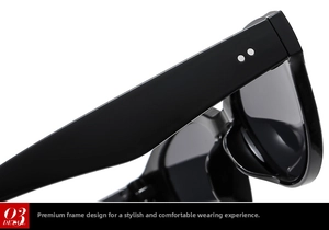 Detail shot of black cat-eye frame with silver rivet studs and polished finish