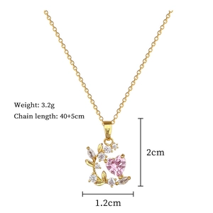 Detail view of heart pendant with pink gemstone and leaves showing size and weight specs