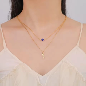 Double-layer gold stainless steel necklace with blue evil eye and Italian horn charms