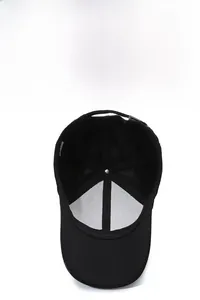 Detail view of black baseball cap showing breathable mesh lining and adjustable metal buckle
