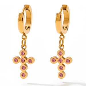 Gold baroque cross earrings featuring round pink cubic zirconia stones on white background