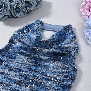 Detailed macro shot of blue gradient sequins and plush knit texture on a sexy crop top