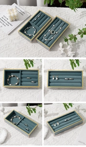 Detail view of premium green velvet jewelry tray with acrylic gold metal frame