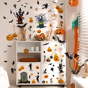 Close-up of Halloween wall stickers featuring Jack-o-lanterns and bats on a white cabinet