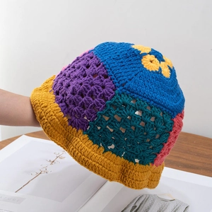 Detailed view of handmade crochet bucket hat featuring colorful patchwork knitting pattern