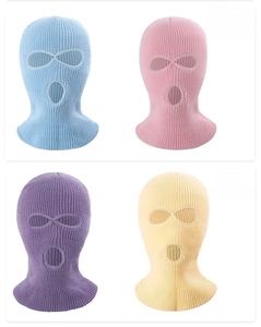 Three-hole knitted winter balaclavas in light blue, pink, purple, and beige colors
