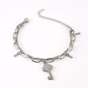Double-layer stainless steel bracelet featuring heart and key charms in silver finish