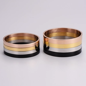 Minimalist polished stainless steel bangles set in gold, rose gold, silver and black finishes
