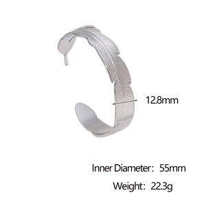 Detail view of silver feather cuff bangle with 12.8mm width and 55mm inner diameter