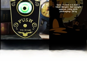Vue détaillée de la sonnette d'Halloween avec œil vert lumineux et motifs vintage