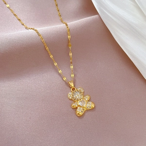 Luxurious gold-plated titanium steel necklace featuring a sparkling bear pendant with zircons