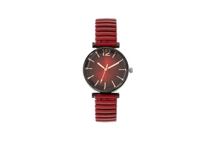 Detailed macro view of the red and black gradient dial on a women's quartz watch