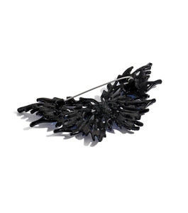 Detailed back view of a dark style crystal butterfly brooch with a secure metal pin clasp