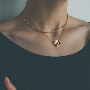 Japanese retro style double-layer gold-plated brass necklace worn by a female model