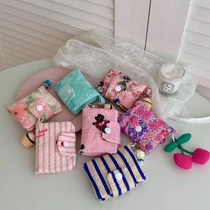 Detail of floral quilted cotton coin purse with snap closure and hanging loop