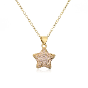 Detailed close-up of 18K gold star pendant with pink pavé zircon stones on chain