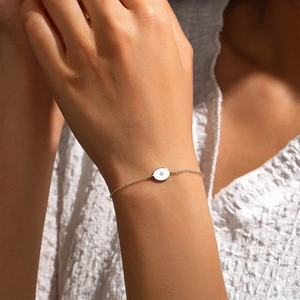 Detailed close-up of S925 sterling silver star pendant bracelet on a woman wrist