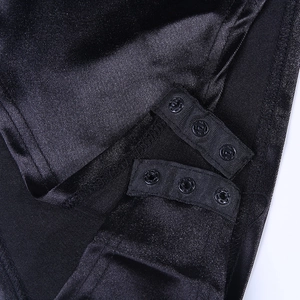 Macro detail of black satin bodysuit featuring adjustable triple snap-button closure