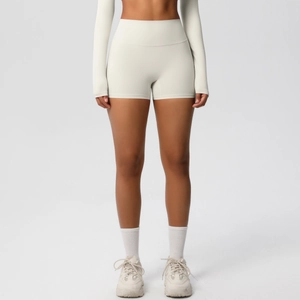 Detailed back view of high-waisted lifting yoga shorts in ivory white matte fabric