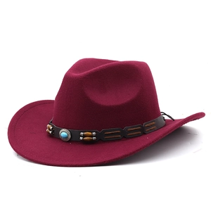 Detail of burgundy wool fedora with turquoise bead leather band in western style