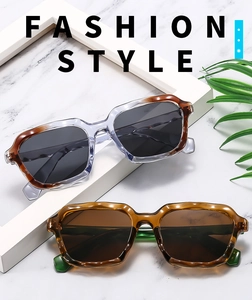 Detail view of retro square sunglasses with wavy frames in amber and tortoiseshell finish