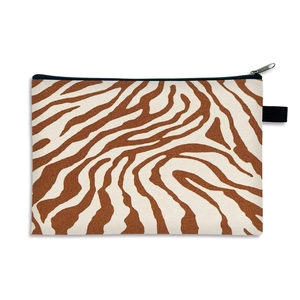 Portable vintage brown leopard print makeup bag with black zipper on white background