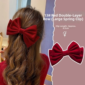 Detail view of 8.2cm red velvet double layered bow hair clip with large spring clip