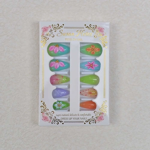 Colorful almond press-on nails with 3D floral art and pastel gradient finish
