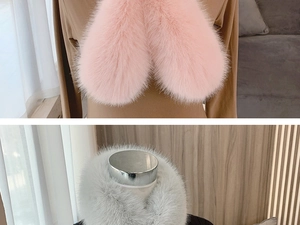 Close-up of fluffy pink and light grey faux fox fur scarves on mannequins
