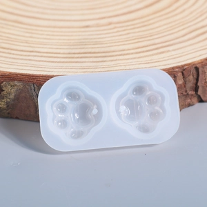 Detail of a 2-cavity cat paw silicone mold for DIY resin heart pendants and crafts