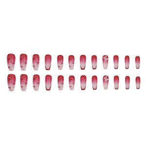 Long coffin press-on nails with red cherry print and 3D white bow decorations