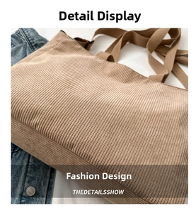 Detailed close-up of khaki corduroy tote bag featuring ribbed texture and wide fabric handles