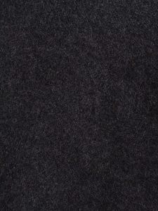 Close-up of the dark charcoal wool blend fabric showing high-density knitted fiber texture