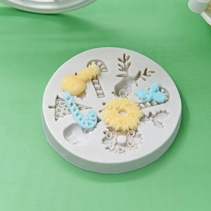 Christmas silicone mold with deer, snowman, and candy cane shapes for DIY cake baking