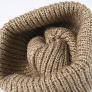 Thick brown knit beanie with ribbed texture for winter warmth and outdoor comfort