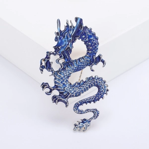 Exquisite blue enamel Chinese dragon brooch pin on a white geometric display stand