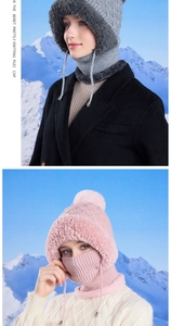 Close-up of cable knit winter hat with warm fleece lining and fluffy pompom detail
