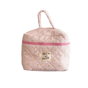 Quilted floral checkered cosmetic bag with top handle and zipper for storage