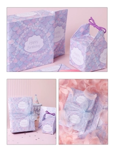 Detail of mermaid scale gift bag and box set with purple ribbons and Happy Birthday text
