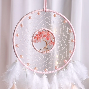 Dream catcher with pink crystal tree of life design and white feathers for wall decor