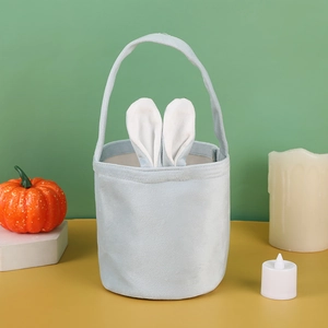 Close-up of a light blue Easter bunny basket with plush rabbit ears and a carry handle