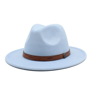 Detail of light blue wool fedora featuring brown patterned leather band and metal badge