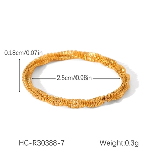 Detail showing 0.18cm width and 2.5cm diameter of golden twisted chain ring