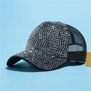 Side view of rhinestone baseball cap with black mesh back and silver crystal details