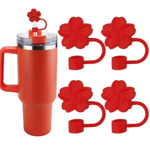 Detail of red flower silicone straw covers set on a matching tumbler with handle