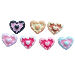 Mini resin heart charms with layered wave design in multiple vibrant colors for DIY crafts