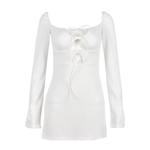 Close-up of white waffle knit dress featuring hollow-out bust detail and lace-up design